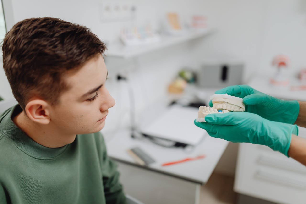 Teen orthodontic consultation comparing Invisalign and braces