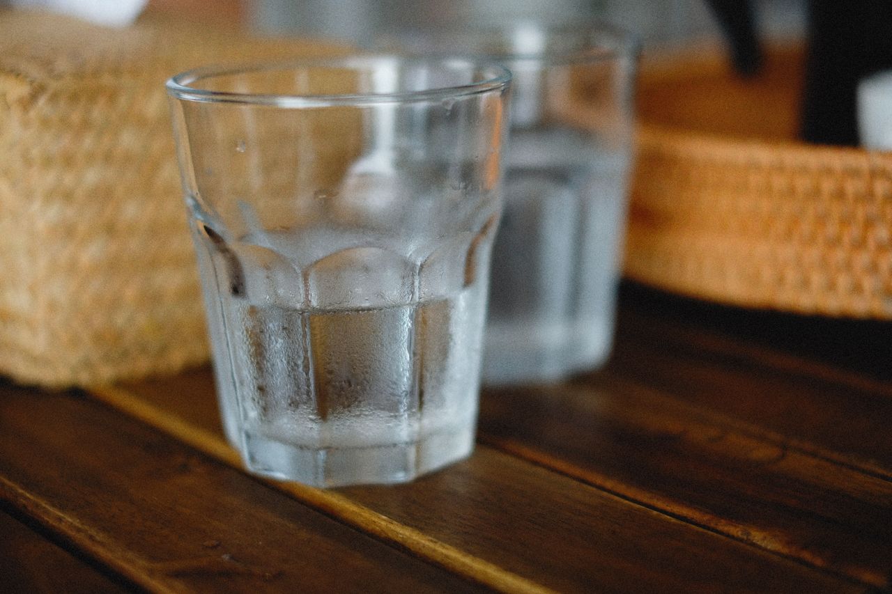 Glass of ice water representing cold-triggered tooth sensitivity